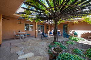 View of patio with a pergola, french doors, a ceiling fan, and outdoor dining space