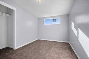 Unfurnished bedroom with carpet floors and a closet