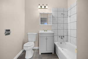 Full bath featuring shower / washtub combination, vanity, and light tile patterned flooring