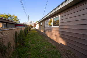 View of side of home featuring a mountain view