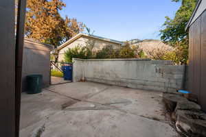 View of patio with a gate