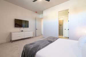 Bedroom featuring light colored carpet and ceiling fan