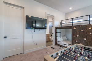 Bedroom with carpet, recessed lighting, and ensuite bath