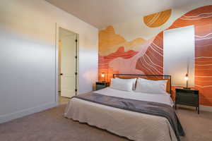 Carpeted bedroom with baseboards