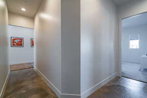 Hall featuring concrete flooring