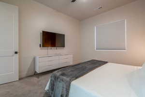 Bedroom with carpet floors and a ceiling fan