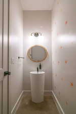 Bathroom featuring baseboards