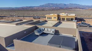 Aerial view of a mountain backdrop and a desert landscape