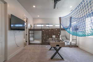 Bedroom featuring carpet flooring, recessed lighting, and a textured ceiling