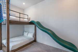 Carpeted bedroom with baseboards