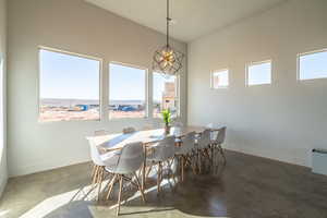 Dining room featuring finished concrete floors and baseboards