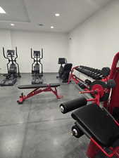 Exercise room featuring recessed lighting and rubber floors