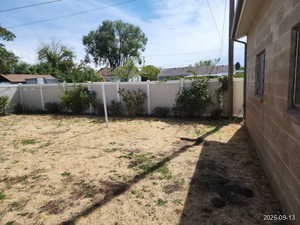 View of fenced backyard