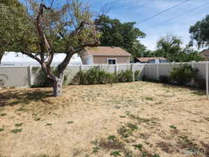 View of fenced backyard