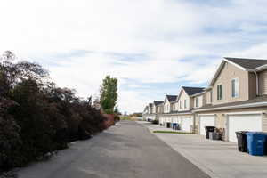 View of asphalt street with a residential view