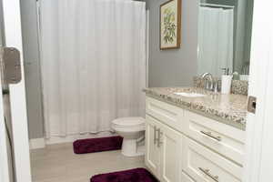 Full bath with vanity and toilet