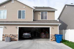 Garage featuring driveway
