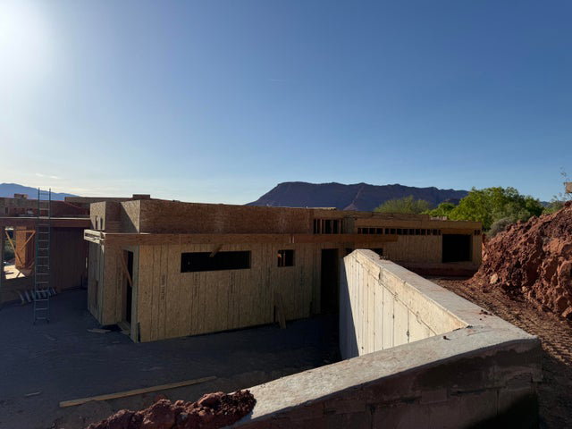 View of side of property with a mountain view
