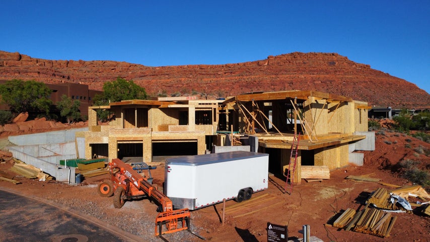 View of front facade featuring a mountain view and stucco siding