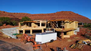 View of front facade featuring a mountain view and stucco siding