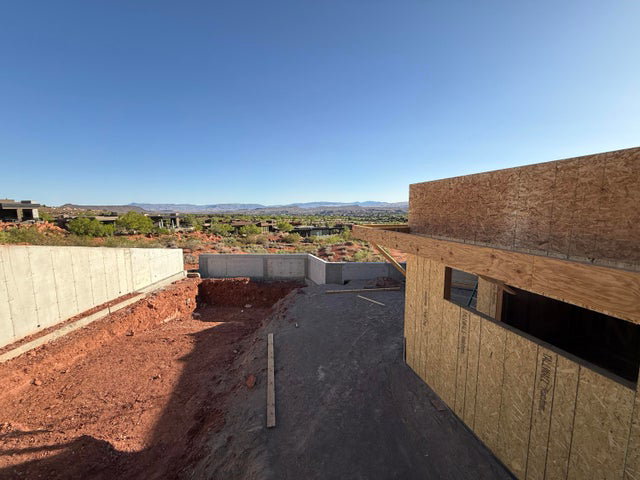 Fenced yard featuring a mountain view