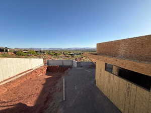 Fenced yard featuring a mountain view