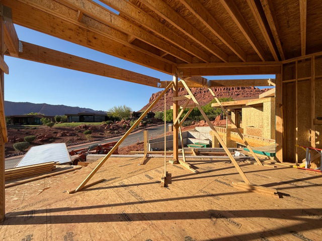 View of jungle gym with a patio area