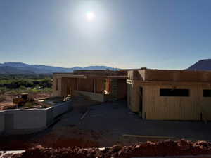 View of side of property featuring a mountain view