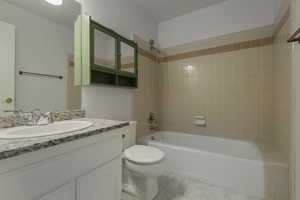 Full bathroom with bathing tub / shower combination and vanity