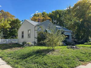 View of home's exterior with a chimney