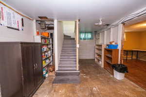 Basement featuring stairs