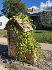 View of home's exterior featuring an outdoor structure