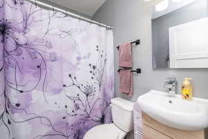 Bathroom with vanity and a shower with shower curtain