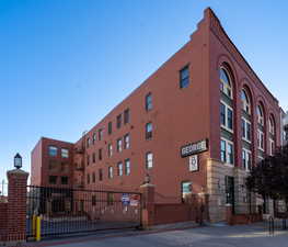 View of apartment building / complex. unit is street facing/ corner, middle floor