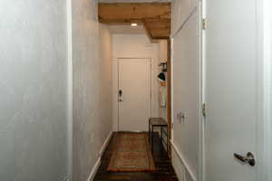 Front door, Entry hallway with utility closet and washer/ dryer stack closet