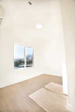 Bedroom 1 featuring light wood-type flooring and baseboards