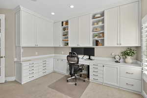 Office featuring built in study area, light colored carpet, and recessed lighting
