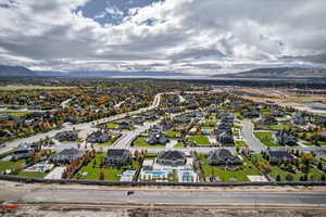 Aerial perspective of suburban area with a mountainous background