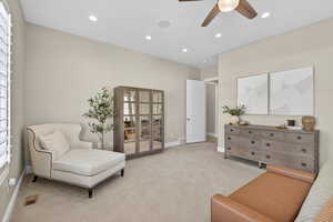 Living area with carpet floors, recessed lighting, and a ceiling fan