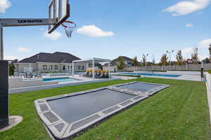 View of yard featuring a patio area, a game area, and a residential view