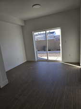 Living room featuring dark wood finished floors and a textured ceiling