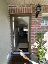 Property entrance with brick siding