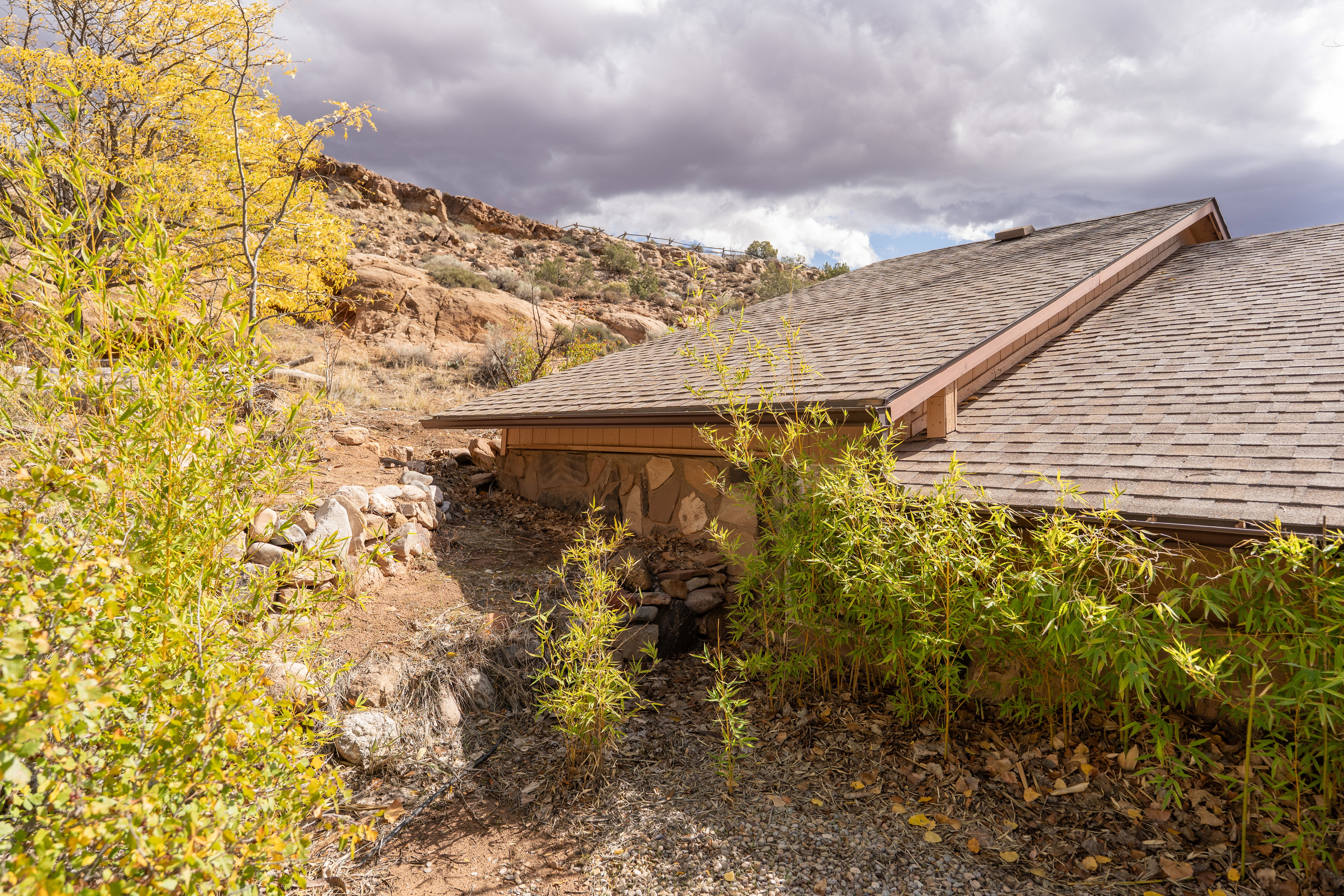 View of property exterior featuring a shingled roof