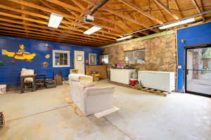 Below grade area featuring a garage and fridge