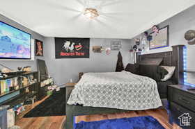 Bedroom with wood finished floors