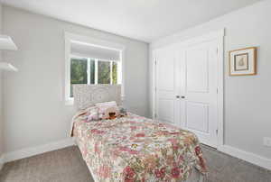 Bedroom with carpet floors and a closet