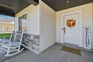 Entrance to property with a porch