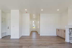Unfurnished living room featuring recessed lighting and light wood-style floors