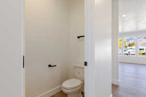 Bathroom featuring recessed lighting and wood finished floors