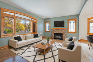 Living room featuring wood finished floors and a tile fireplace